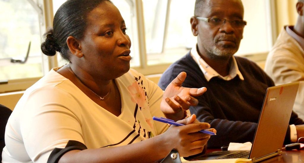 Director of the International Rotary Peace Centre at Makerere University, Dr. Helen Nambalirwa Nkabala with colleagues at a meeting